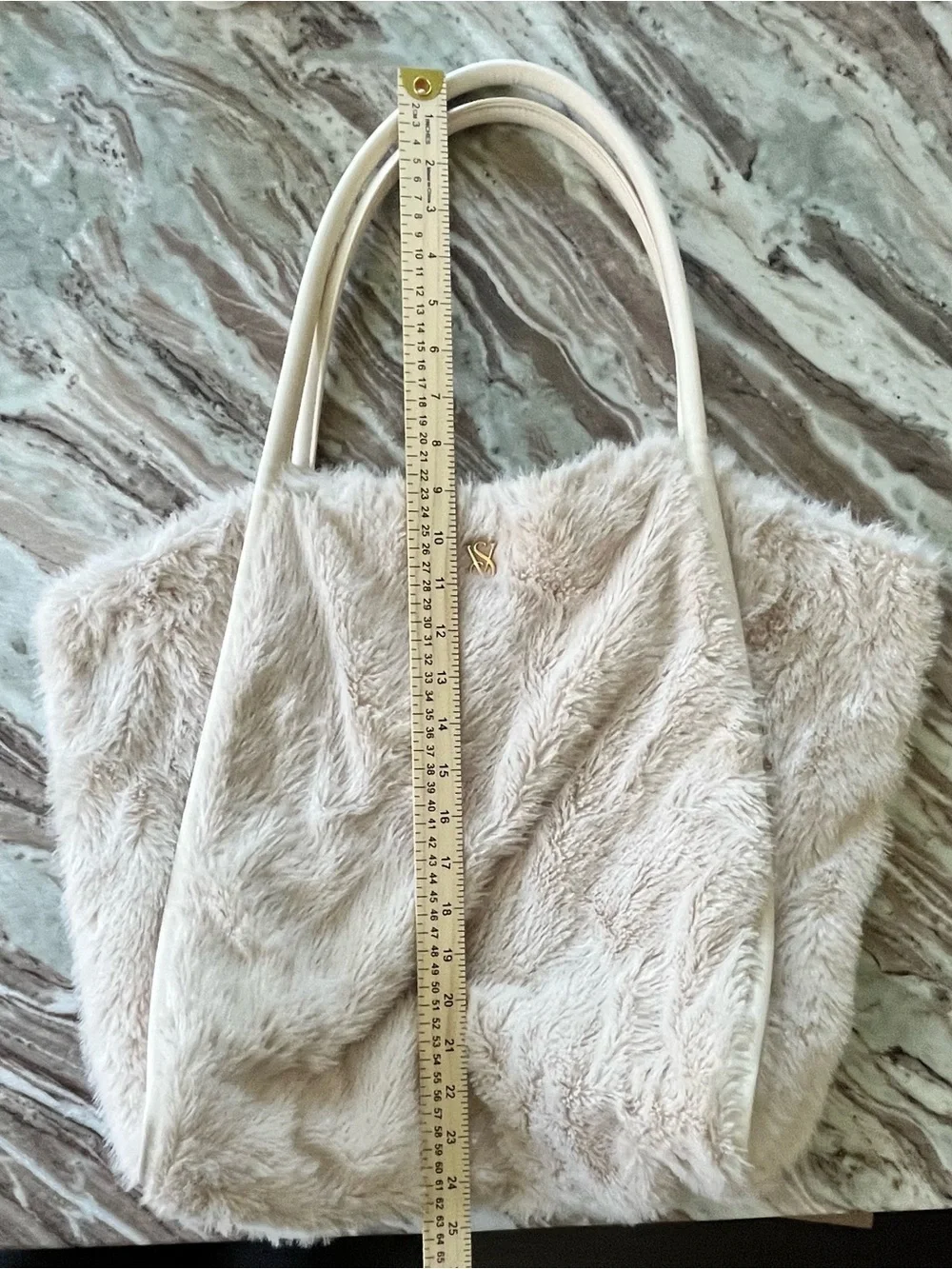 Cream Victoria’s Secret Faux-Fur Tote Bag with gold VS logo